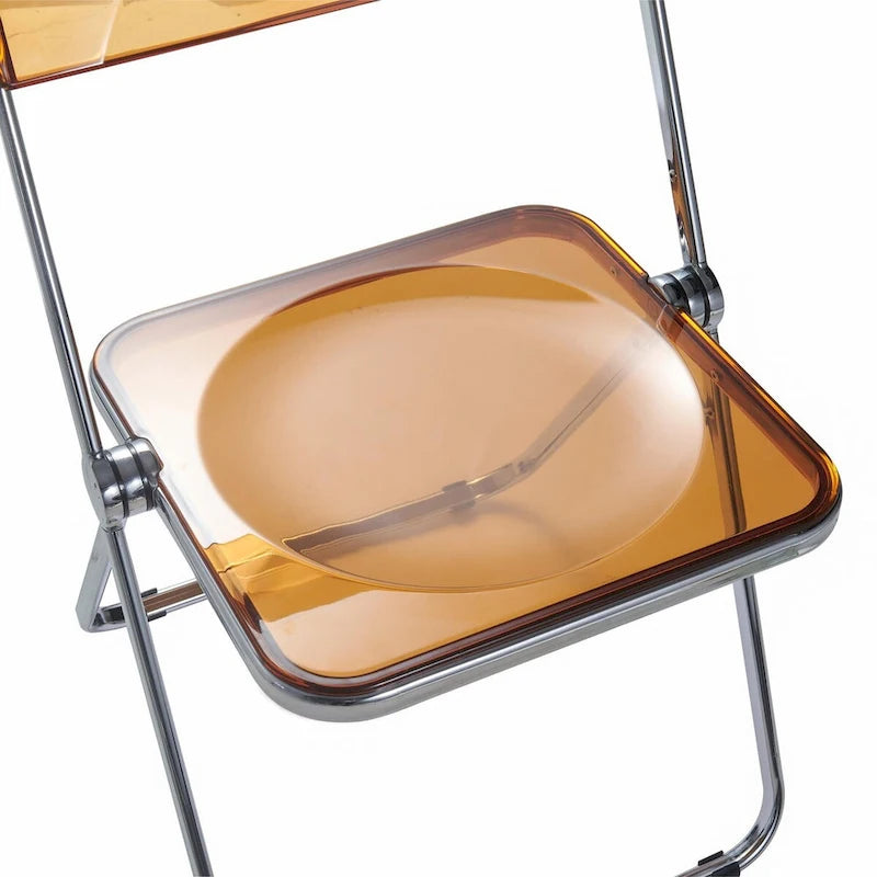 Quatre chaises de salle à manger pliantes en acrylique, cadre chromé