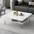 Table basse : 4 pieds dorés, 2 tiroirs, design carré à double plateau.